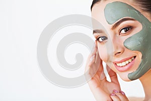 Beauty face skin care. Woman with cosmetic spa facial mask.