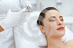 Beauty Face Skin Care. Woman Getting Oxygen Spray Treatment
