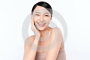 Beauty face. Smiling asian woman touching healthy skin portrait. Beautiful happy girl model with fresh glowing hydrated facial