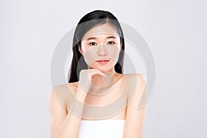 Beauty face. Smiling asian woman touching healthy skin portrait. Beautiful happy girl model with fresh glowing hydrated facial