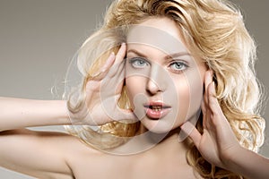Beauty face woman. Girl healthy model in spa salon. Cream treatment products. Facial skin terapy photo