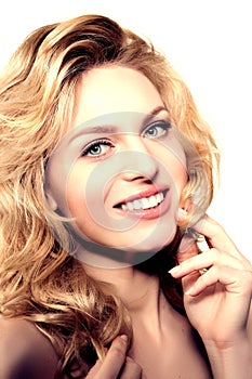 Beauty face woman. Girl healthy model in spa salon. Cream treatment products. Facial skin terapy. Beautiful smile, teeth. Dental