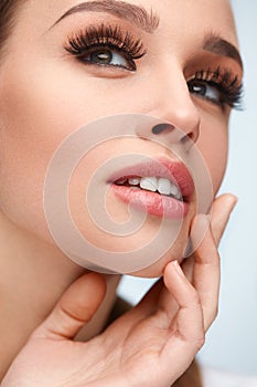 Beauty Face. Woman With Makeup, Soft Skin And Long Eyelashes