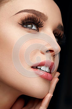 Beauty Face. Woman With Makeup, Soft Skin And Long Eyelashes