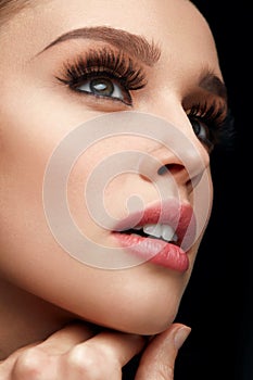 Beauty Face. Woman With Makeup, Soft Skin And Long Eyelashes