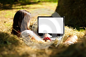 Beauty on a farm with laptop.