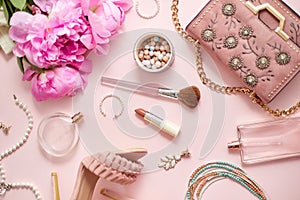 Beauty and fashion accessories and gadgets. Femine concept. Flat lay on pink theme background photo