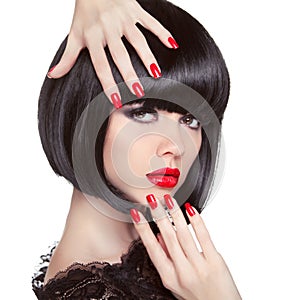 Beauty fashion brunette model portrait. Manicured nails.