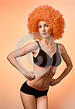 Beauty fashion. Fitness woman athletic body, unusual, afro