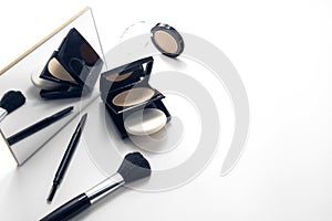 beauty fashion of makeup cosmetic skincare powder foundation with brush black on white background,