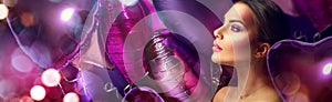 Beauty fashion model girl creative art makeup, over purple, pink and violet air balloons background
