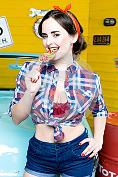 Beauty fashion model girl Eating colourful lollipop. Lollypop.