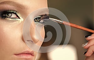 Beauty Fashion model girl. Fashion look. Woman mascara applying brush, female portrait makeup eyelashes