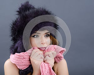 Beauty Fashion Model Girl in a Fur Hat. Beautiful Stylish Woman