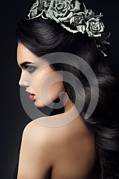 Beauty Fashion Model Girl Portrait with Grey Roses
