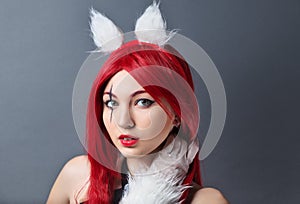 Beauty Fashion Model Girl with red wig on gray background.