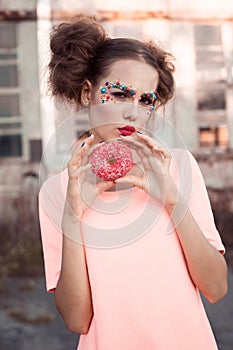 Beauty fashion model girl taking colorful donuts. Funny joyful woman with sweets, dessert. Diet, dieting concept. Junk food, Slimm