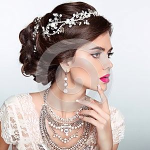Beauty Fashion Model Girl with wedding elegant hairstyle. Beautiful bride woman with precious jewels, manicured nails. Makeup.