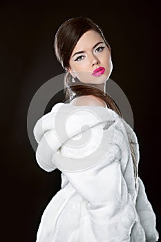 Beauty Fashion Model Girl in white mink Fur Coat. Beautiful Luxu