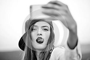 Beauty fashion model portrait. Young girl making selfie