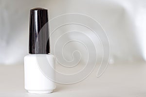 Beauty, fashion and Nail art concept. Manicure bottle white gel nail polish mock up with copy space