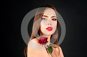 Beauty fashion portrait. Beautiful woman with makeup and rose flowers on black  background. Inspiration of