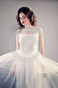 Beauty Fashion Portrait of Pretty Fiancee wearing Wedding Dress