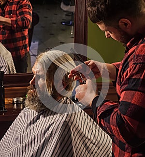 Beauty and fashion. Portrait of stylish man beard. shaving. Hairstylist in barbershop. man in hair salon with hipster