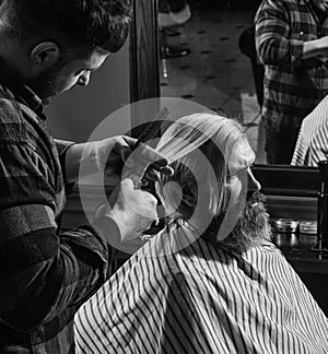 Beauty and fashion. Portrait of stylish man beard. shaving. Hairstylist in barbershop. man in hair salon with hipster