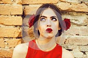 Beauty fashion portrait. woman with red lips and fresh roses in hair