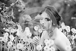 Beauty fashion portrait. young woman with fashionable makeup and beads in green leaves