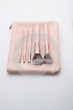 Beauty and Fashion: Set of Make up Brushes Shot in StudioBeauty and Fashion: Set of Make up Brushes with Pink Leather Pouch Shot i