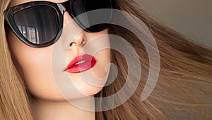 Beauty, fashion and style, face portrait of beautiful woman wearing stylish cat eye sunglasses and red lipstick make-up