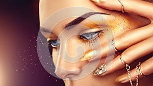 Beauty fashion woman with golden makeup