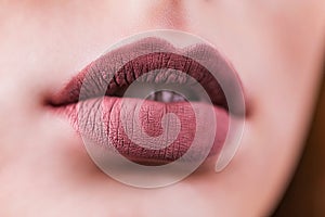 Beauty Fashion woman lips with natural Makeup. Matte lipstick. Beauty girl face close up. Nude Colors. lips