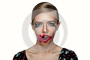 Beauty female Model with smeared red Lipstick on open Mouth.