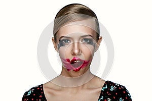 Beauty female Model with smeared red Lipstick on open Mouth. photo