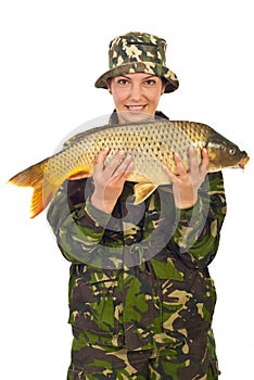 Beauty fisher woman holding carp