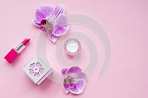 Beauty flat lay with cosmetic bottles and flowers. Top view. female accessories.Beauty blog concept. Accessories, flowers,