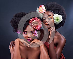 Beauty, flowers and black women with skincare, art and eco friendly cosmetics in studio for spring. Natural, afro and