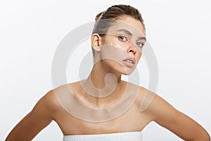 Beauty girl of caucasian woman checks her skin, skin care, acne treatment.
