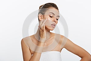 Beauty girl of caucasian woman checks her skin, skin care, acne treatment.