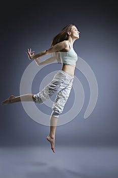 Beauty girl dance on grey