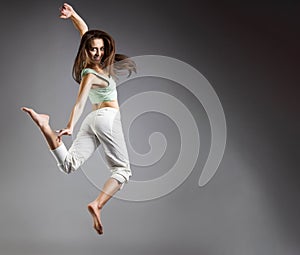 Beauty girl dance on grey background