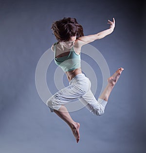 Beauty girl dance on grey background