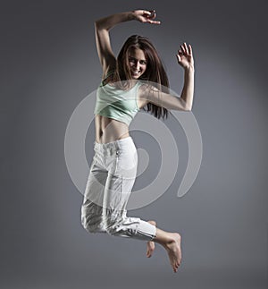 Beauty girl dance on grey background