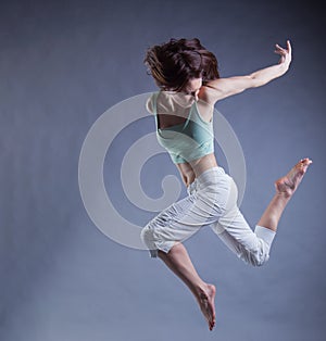 Beauty girl dance on grey background