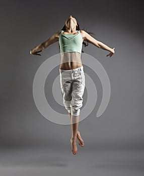 Beauty girl dance on grey background