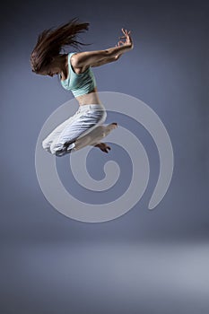 Beauty girl dance on grey background