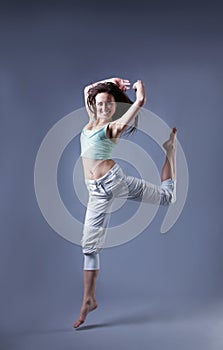 Beauty girl dance on grey background